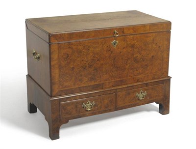 Lot 1474 - A George II Figured Walnut and Featherbanded Chest on Stand, mid 18th century, the quarter-veneered