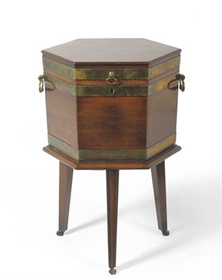 Lot 1481 - A George III Mahogany and Brass Bound Wine Cooler, circa 1800, of hexagonal shaped form with...