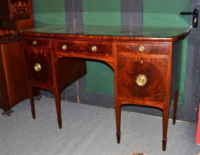 Lot 1491 - A George III Mahogany Crossbanded and Boxwood Strung Sideboard, circa 1800, of bowfront form fitted