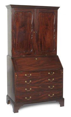 Lot 1492 - A George III Mahogany Bureau Bookcase, mid 18th century, the drawer with paper label of Philip Bell