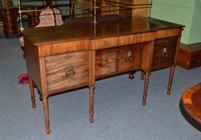 Lot 1502 - A Regency Mahogany Breakfront Sideboard, 2nd quarter 19th century, with elegant brass spindle...