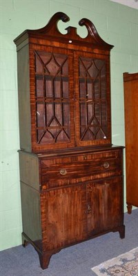 Lot 1504 - A George III Mahogany and Ebony Strung Secretaire Bookcase, late 18th century, with swan neck...