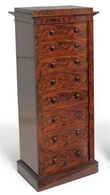 Lot 1506 - A Victorian Mahogany Wellington Chest, mid 19th century, the staged top above eight graduated...