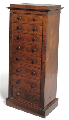 Lot 1507 - A Victorian Mahogany Wellington Chest, mid 19th century, the staged top above eight graduated...