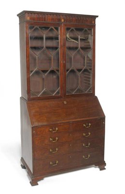 Lot 1512 - A George III Mahogany Bureau Bookcase, circa 1800, with a dentil and arcaded cornice above astragal