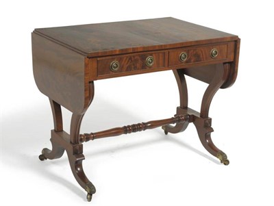 Lot 1514 - A Regency Mahogany Sofa Table, 2nd quarter 19th century, with two rounded drop leaves above two...