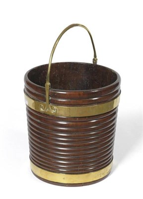 Lot 1521 - A George III Brass Bound Mahogany Peat Bucket, late 18th century, the ribbed body of coopered...