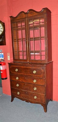 Lot 1527 - A Regency Mahogany Secretaire Bookcase, early 19th century, the moulded domed pediment above...