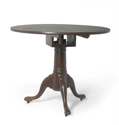 Lot 1531 - A George II Mahogany Tripod Table, mid 18th century, the circular two piece top above a bird...