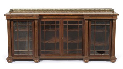 Lot 1536 - A Mahogany Breakfront Bookcase, mid 19th century, the pierced three-quarter brass gallery above...