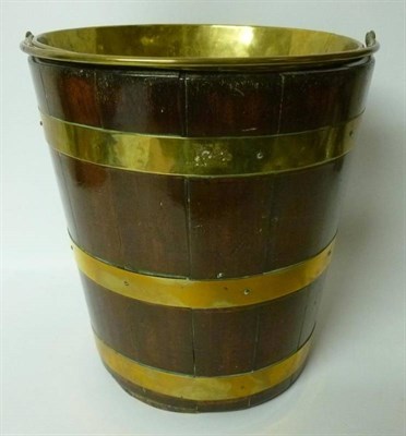 Lot 1548 - A George III Mahogany and Brass Bound Bucket, early 19th century, of tapering staved...