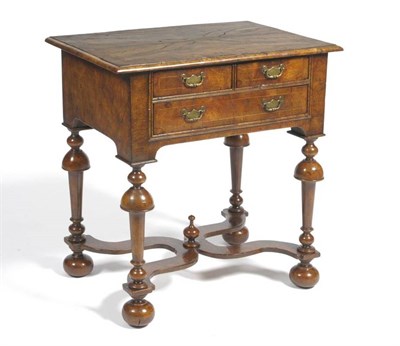 Lot 1550 - A Walnut, Boxwood and Crossbanded Dressing Table, the quarter veneered top above two and one...