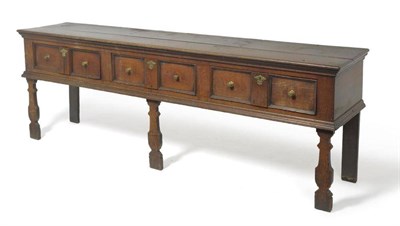 Lot 1554 - An Early 18th Century Oak Sideboard Dresser, the moulded top above three frieze drawers, raised...