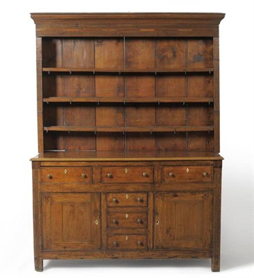 Lot 1560 - An 18th Century Oak and Pine Enclosed Dresser and Rack, the bold cornice above three fixed...