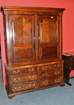 Lot 1567 - An 18th Century Joined Oak and Mahogany Crossbanded Housekeeper's Cupboard, the bold cornice...