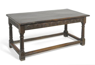 Lot 1569 - A 17th Style Oak Refectory Table, of four plank construction with cleated ends above a lunette...