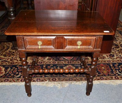 Lot 1571 - A Late 17th Century Joined Oak Writing Table, with a two-as-one frieze drawer, raised on turned and