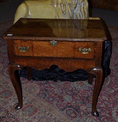 Lot 1572 - A George II Oak Side Table, mid 18th century, the moulded top with re-entrant corners above a...