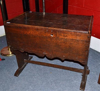 Lot 1576 - A 16th Century Joined Oak Counter Table/Chest, with hinged boarded lid, shaped end supports and...