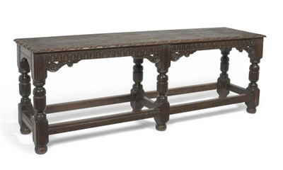 Lot 1581 - A Carved Oak Serving Table, the rectangular top of six-plank construction with an egg and dart...