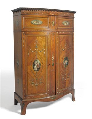 Lot 1588 - A Sheraton Revival Satinwood and Polychrome Painted Bowfront Wardrobe, late 19th century, the...