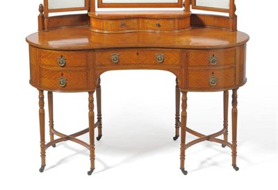 Lot 1602 - An Edwardian Satinwood and Boxwood Strung Dressing Table, circa 1900, of kidney shaped form,...