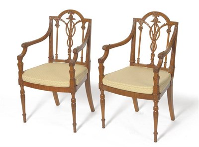 Lot 1607 - A Pair of Carved Satinwood Hepplewhite Style Armchairs, late 19th century, with acanthus carved...