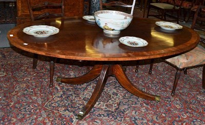 Lot 1609 - A Late George III Mahogany Satinwood Banded Breakfast Table, early 19th century, of broad oval...