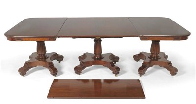 Lot 1613 - A Victorian Mahogany Triple Pillar Extending Dining Table, mid 19th century, the centre section...