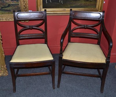 Lot 1619 - A Set of Seven Regency Mahogany Dining Chairs, circa 1820, with reeded uprights, drop-in seats,...