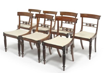 Lot 1623 - A Harlequin Set of Seven Rosewood Dining Chairs, 2nd quarter 19th century, with curved top...