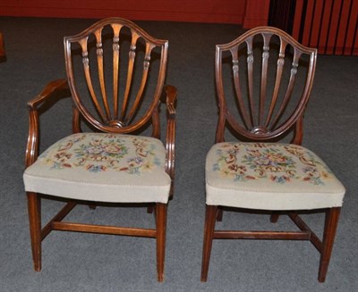 Lot 1626 - A Harlequin Set of Eight Mahogany Hepplewhite Style Dining Chairs, the shield shape back...