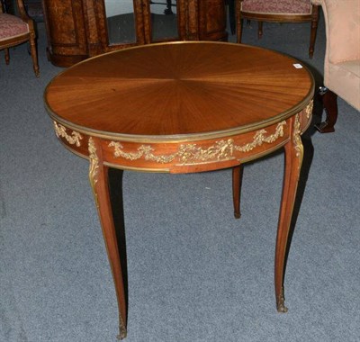 Lot 1637 - A Louis XVI Style Mahogany and Gilt Metal Mounted Circular Table Ambulant, circa 1900, with...