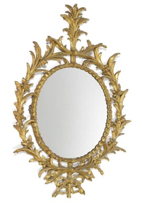 Lot 1663 - An 18th Century Gilt and Gesso Oval Pier Glass, of rococo form, with flowerhead moulded frame...