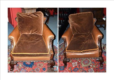 Lot 1677 - A Pair of Early 20th Century Carved Mahogany Easy Chairs, upholstered in brown close-nailed...