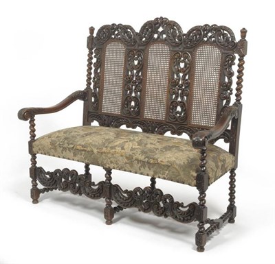 Lot 1684 - A 17th Century Style Anglo-Dutch Walnut Three-Seater Settee, early 20th century, recovered in green