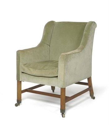 Lot 1687 - A George III Style Wingback Armchair, 19th century, upholstered in green velvet with square...