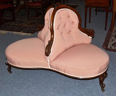 Lot 1688 - A Victorian Walnut Framed Conversation Settee, 3rd quarter 19th century, recovered in red and cream