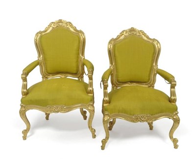 Lot 1691 - A Pair of Louis XV Style Giltwood and Gesso Fauteuils, late 19th century, upholstered in green silk