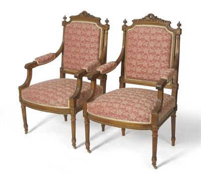 Lot 1692 - A Pair of Louis XVI Style Beechwood Fauteuils, late 19th century, recovered in pink leaf design...