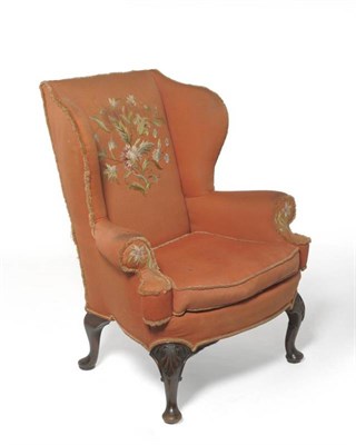 Lot 1694 - An 18th Century Style Wing Back Chair, upholstered in orange and floral needlework fabric, with...