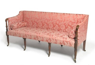 Lot 1701 - A George IV Mahogany Settee, 2nd quarter 19th century, upholstered in pink floral damask with...