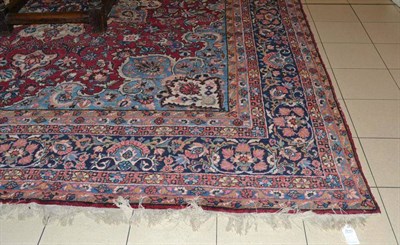 Lot 1401A - Yazd Carpet South East Persia The raspberry field of scrolling floral vines around an ivory and...