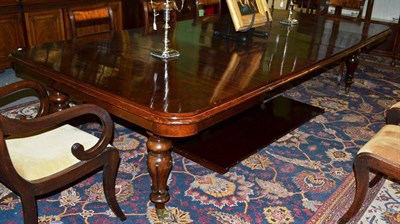 Lot 1613A - A William IV Mahogany Extending Dining Table, the moulded top on lotus carved baluster legs...