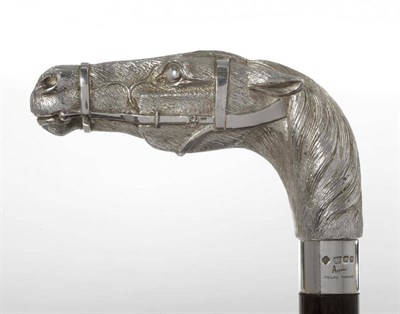 Lot 668A - An Elizabeth II Silver Horsehead Handled Walking Stick, Asprey, London 1997, as a bridled racehorse