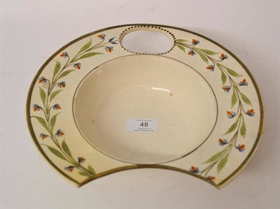 Lot 48 - A Creamware Barber's Bowl, circa 1790, of traditional circular form, the rim with large pierced...