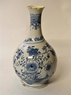 Lot 57 - An English Delft Gugglet, possibly Liverpool, circa 1750, painted in blue with a peacock...