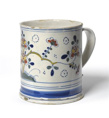Lot 58 - An English Delft Mug, probably Lambeth, circa 1730, of cylindrical form with strap handle,...