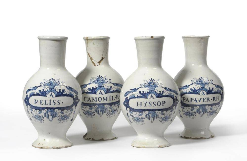 Lot 70 - A Set of Four Dutch Delft Drug Jars, mid 18th century, of ovoid form with tall slightly flared...