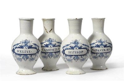 Lot 70 - A Set of Four Dutch Delft Drug Jars, mid 18th century, of ovoid form with tall slightly flared...